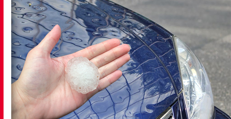 hand holding large chunk of hail
